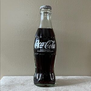 1996 Coca-Cola Bottle with Silver Cap